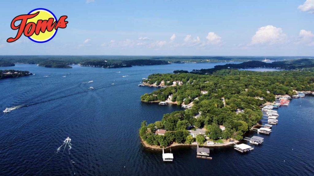 An overhead view of the Lake of the Ozarks MO with the Tom's logo in the top left corner.