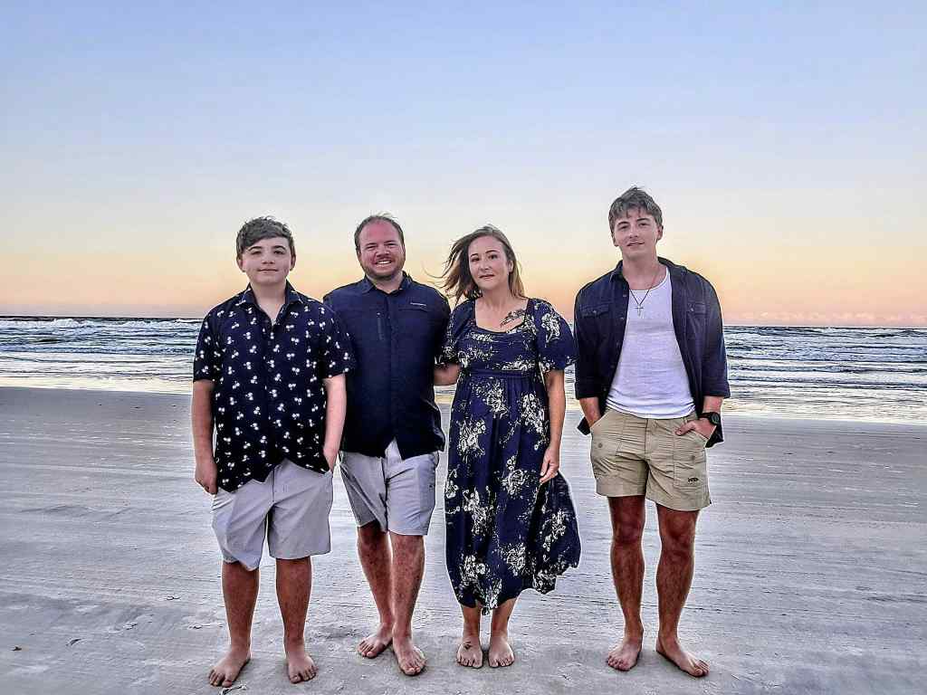 Tony, Ashlee, Zayne, and Gavin Koth family picture at the beach