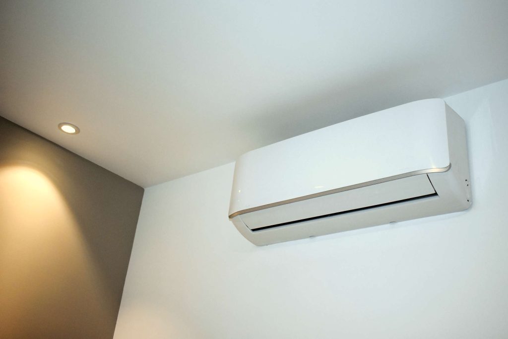Photo of a ductless-mini split mounted on the wall in a home.