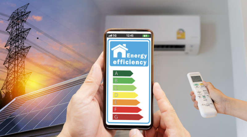 Young man adjusting air conditioner to save energy, emphasizing the benefits of duct cleaning for improved HVAC efficiency.